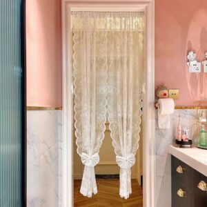 Romantic sheer doorway curtain tied back with decorative bow tie