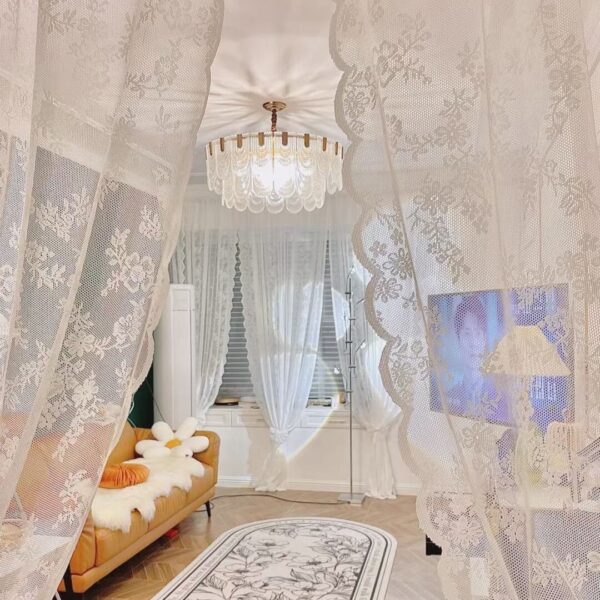 White sheer lace doorway curtain as soft room divider