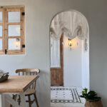 French‑style arch doorway decorated with white sheer arch door valance curtain