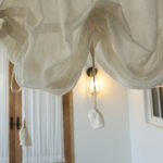 Breathable sheer fabric close‑up of white arch door valance curtain