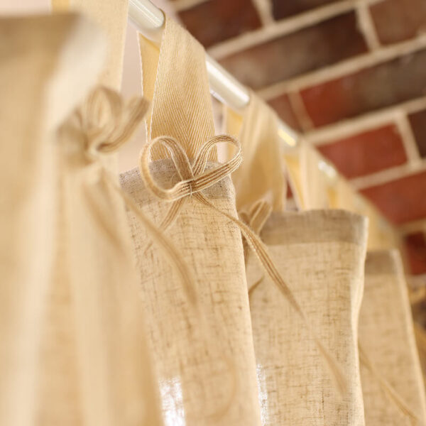 Close‑up of hidden inner lifting straps on linen blend woven curtain