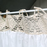 Close‑up view of hollow‑out lace header for boho kitchen window curtain