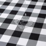 Close‑up view of durable gingham woven tablecloth texture