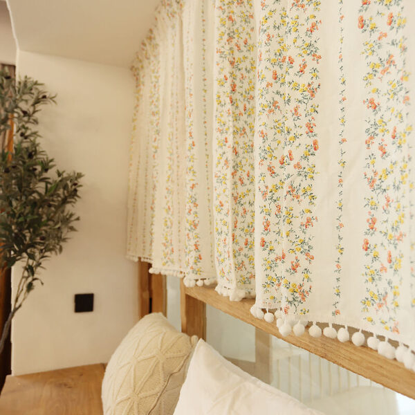 english floral cotton linen cafe curtains hanging on indoor kitchen window