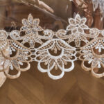 Close‑up of embroidered lace trim for clear vinyl table protector