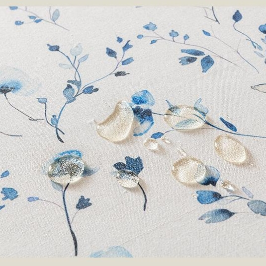 Close‑up texture of blue tropical floral print table cloth fabric