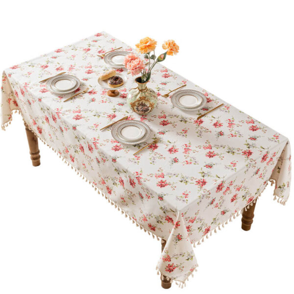 Resort‑style tropical floral table cloth laid on rectangular dining table