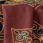 Corner detail of arabesque jacquard tablecloth, vintage oriental woven scroll motif