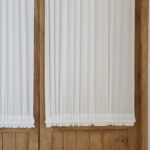 linen‑like textured surface of white dual rod pocket curtain panel