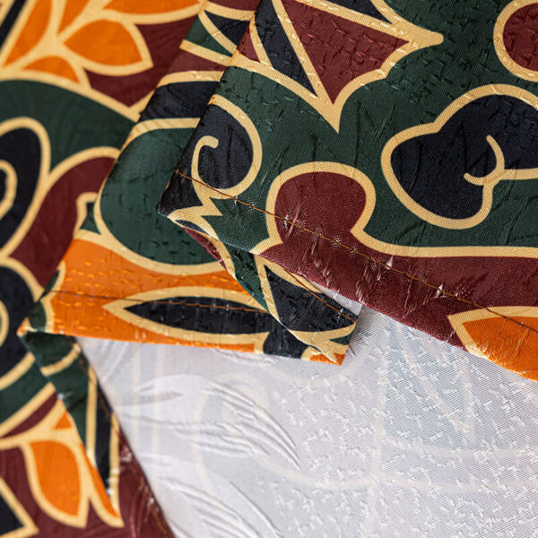 Close‑up view of arabesque scroll jacquard woven texture, polyester tablecloth fabric detail