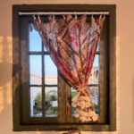 Boho Paisley Half Curtain clipped on wooden window, vibrant exotic turkish bohemian decor for accent window