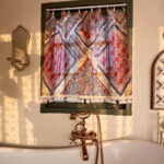 Boho Paisley Half Curtain semi‑sheer decorative curtain, warm sunlight filters through vibrant paisley print tassel curtain