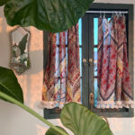 Boho Paisley Half Curtain in bohemian styled room with green plants, clip‑on tassel tier curtain decor