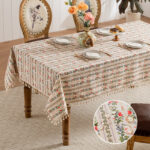 Rectangular ditsy floral tablecloth with neat row‑arranged flowers and tassel fringe, cottage‑core dining decor