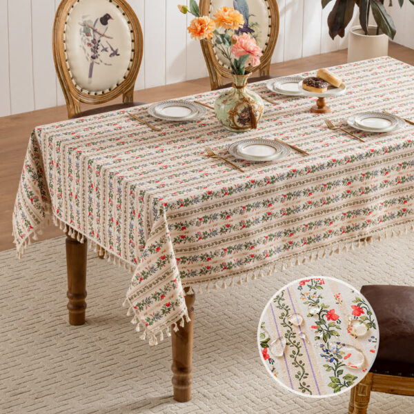Rectangular ditsy floral tablecloth with neat row‑arranged flowers and tassel fringe, cottage‑core dining decor
