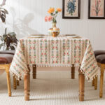Cottage‑core dining room setting with rectangular row floral tassel tablecloth
