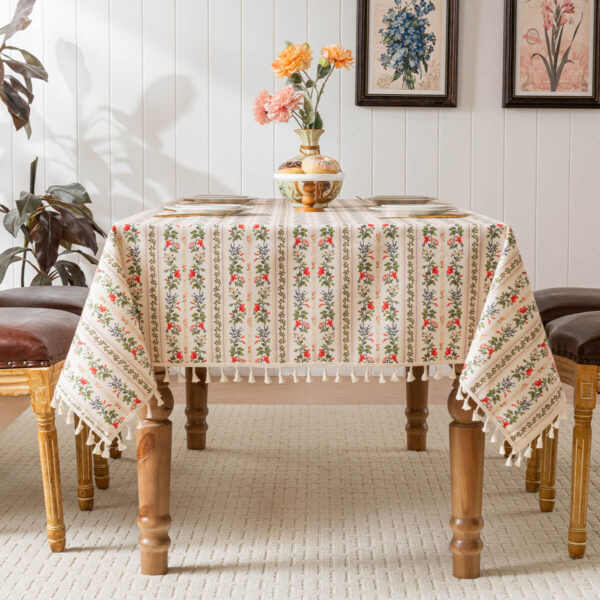 Cottage‑core dining room setting with rectangular row floral tassel tablecloth