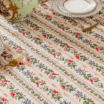 Close‑up of neat row‑arranged ditsy floral print on rectangular tablecloth fabric