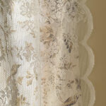 closeup of bird print lace fabric for rod pocket doorway curtain cottage decor