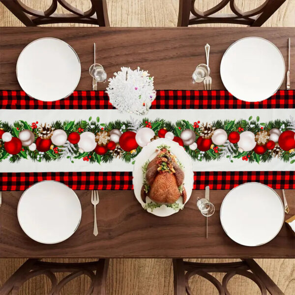 Buffalo plaid Christmas table runner with festive baubles for holiday dining