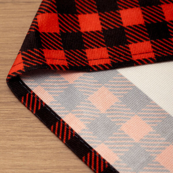 Water‑resistant Christmas table runner fabric close‑up, plaid reverse side