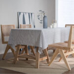 Two styles of striped linen blend tablecloth displayed side by side