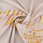 Close‑up view of round christmas waterproof tablecloth fabric texture and scalloped edge