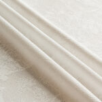 Detail shot of scalloped edge and floral jacquard lace texture