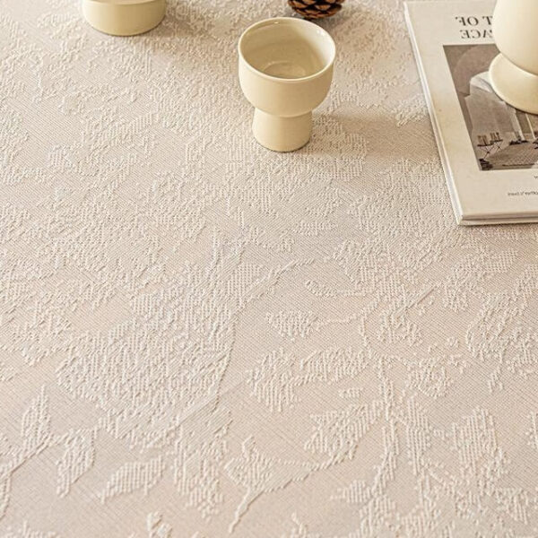 White lace jacquard tablecloth styled with ceramic home decor accessories