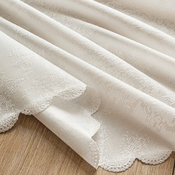 Close‑up of white lace jacquard woven fabric texture