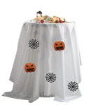 White round Halloween tablecloth printed with pumpkin and spider web motifs for holiday party decoration