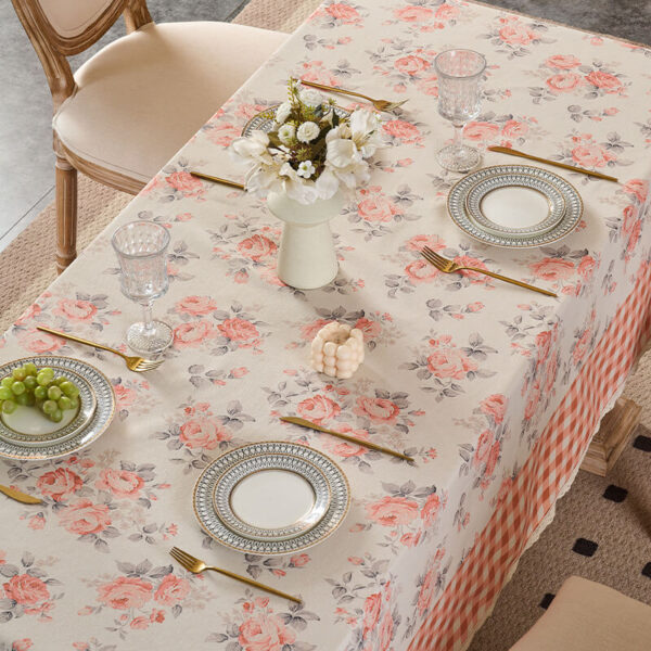Decorative floral tablecloth styled with tableware for home display