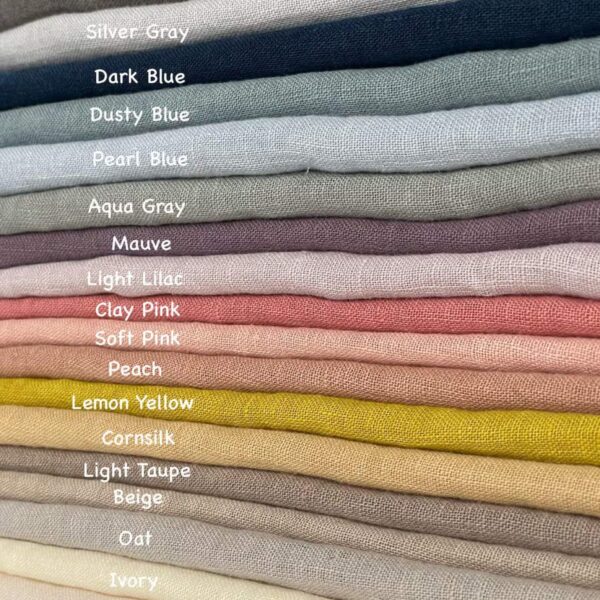 Stack of folded muted color 100% pure linen fabrics, softened natural linen swatches